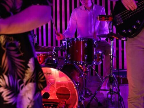 male musician playing drums
